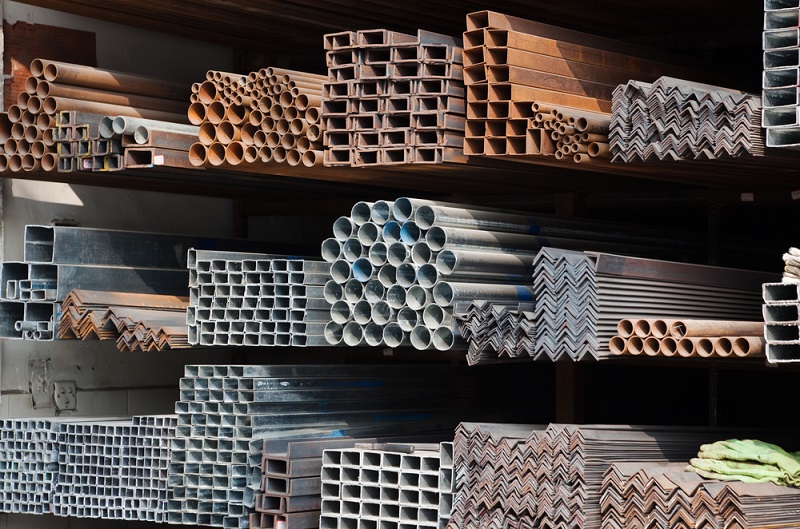 A Series Of Different Sizes Metal Pipes On Shelf